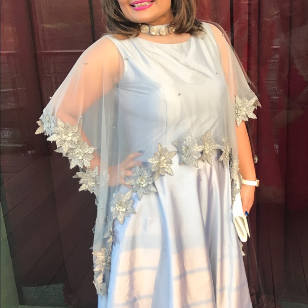In gray color floor touch gown with styleist scarf with neckline work